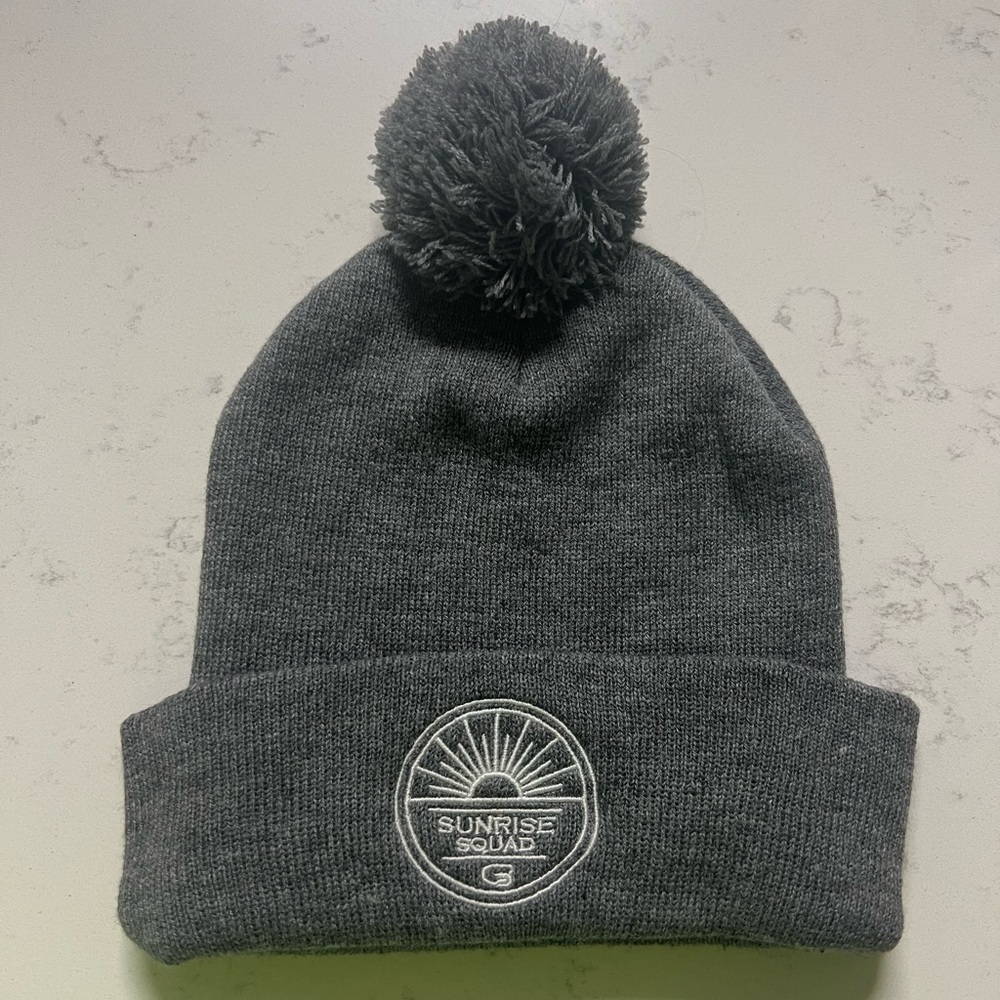 Grey cyclebar beanie with white lettering that says sunrise squad